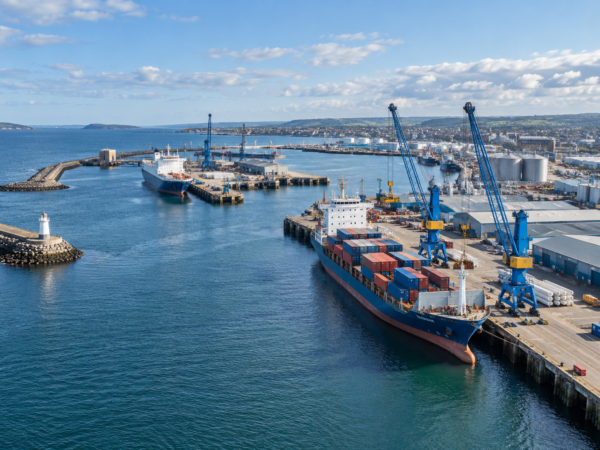 Commercial seaport with cranes and cargo vessels